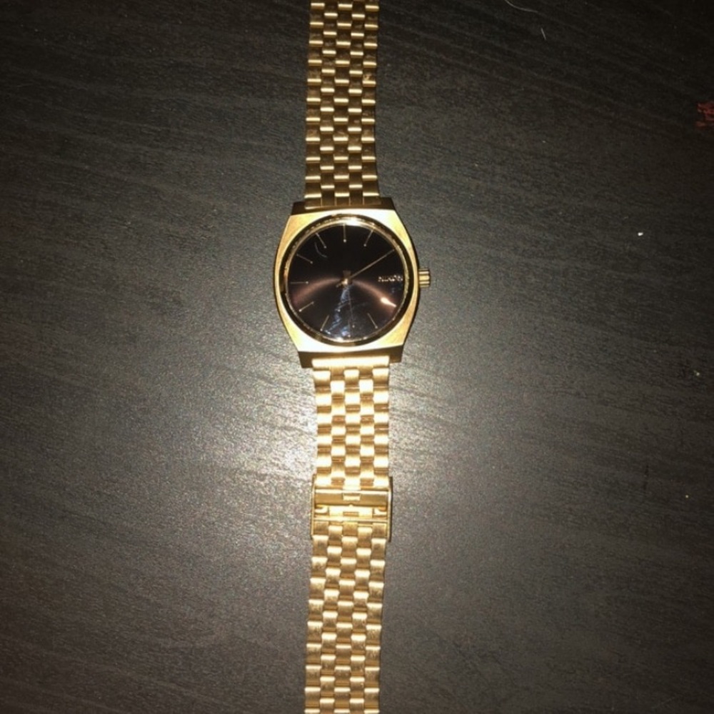 Nixon Time Teller Watch. Gold band, black interior